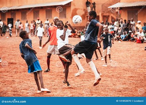 Black African Children, Boys and Adults Playing Soccer Editorial Image ...