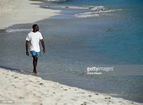 5,007 Black Man Walking On Beach Stock Photos, High-Res Pictures, and ...