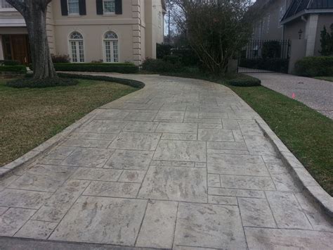 This stamped concrete driveway brings out the best in this house ...