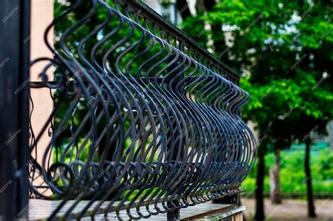 Premium Photo | Decorative black wrought iron fence