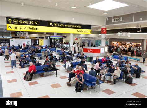 Gatwick airport departure lounge and direction signs Stock Photo ...