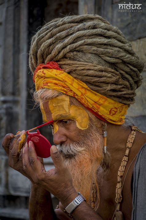 Sadhu Baba Makeup - Sadhu baba applying colors on his face early in the ...