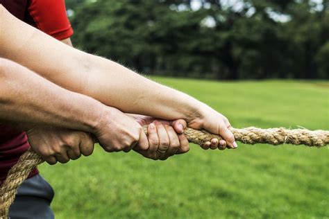 Team competing in tug of war | Premium Photo - rawpixel