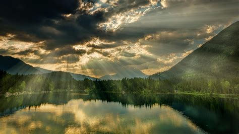 Calm Body of Water Near Mountains · Free Stock Photo