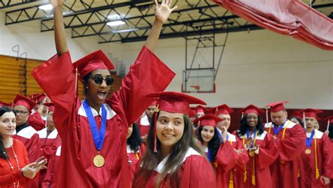 Diplomas span generations at New Bedford High School graduation