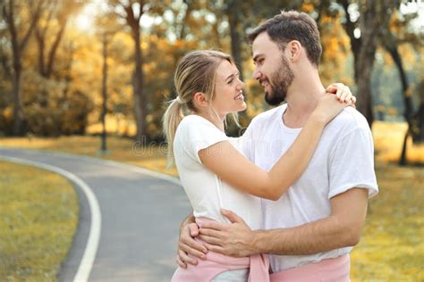 Young Couple People are in Love. Hugging in the Park during Autumn ...