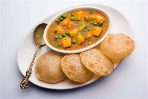 Aloo Sabzi with Gravy Accompanied by Fried Puri Stock Image - Image of ...