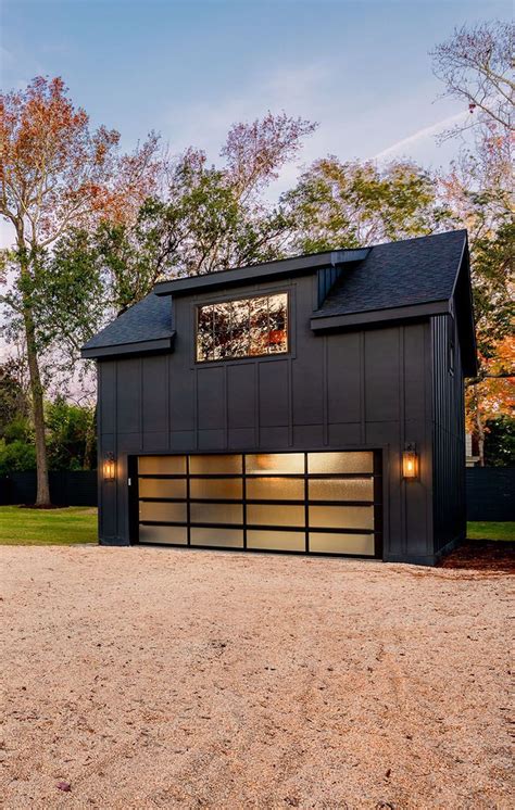 Ultra modern all black detached garage with double wide door and living ...