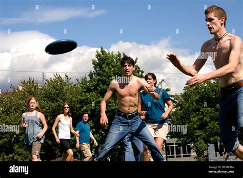 Group of people playing Frisbee in the park Stock Photo - Alamy