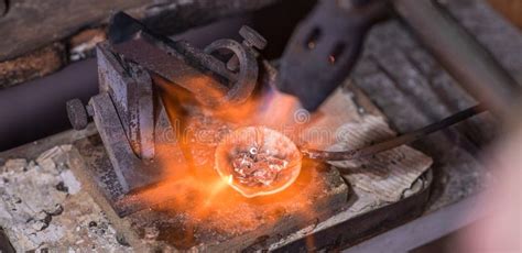 Melting Process of Precious Metal Gold Behind a Jeweler`s Workbench ...