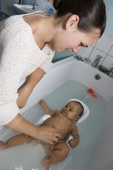 Mother bathing her baby daughter - Stock Image - C046/5583 - Science ...