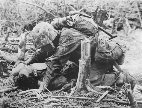 1st Div Marine Gives Water to Wounded Buddy on Peleliu | World War Photos