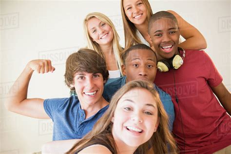 Teenagers smiling together - Stock Photo - Dissolve