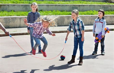 Children Playing Skipping Rope Jumping Game Stock Image - Image of ...