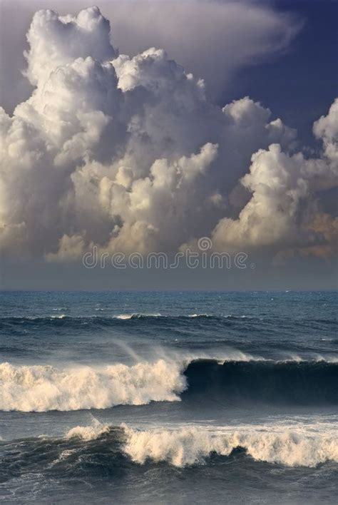 Photo about Ocean in a rough sea with heavy storm clouds. Image of ...