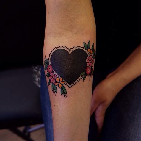 Black heart tattoo with flowers - Tattoogrid.net