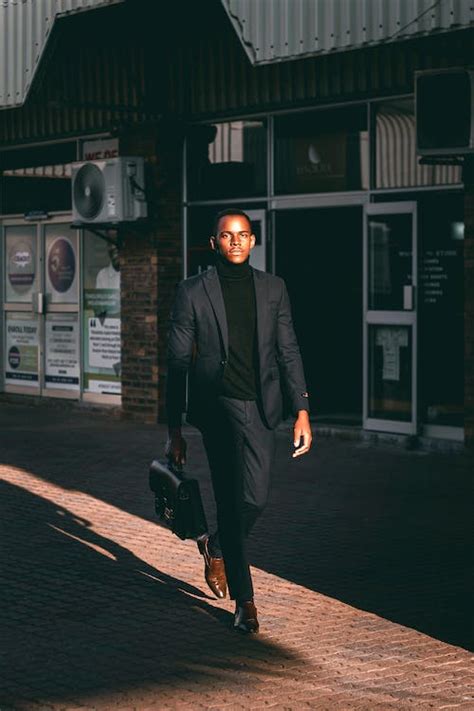 Man Walking in Black Suit · Free Stock Photo