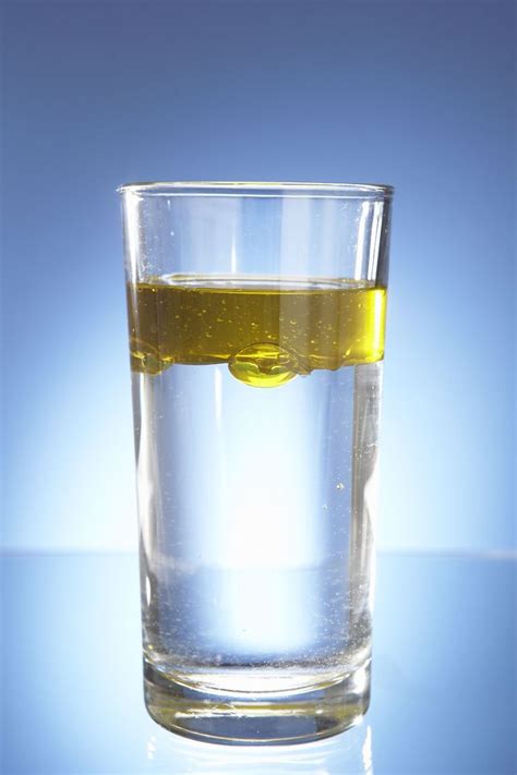 Water and oil don't mix because of density. Oil is less dense than ...