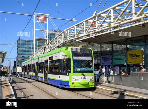 London Trams tram waiting at a stop outside East Croydon railway ...