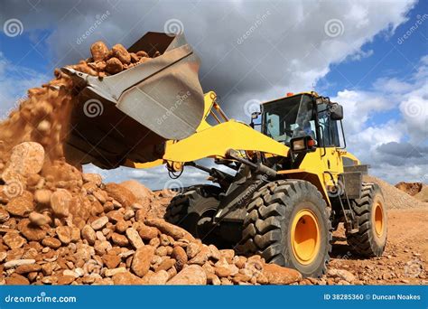 Front End Loader Tipping Stone Stock Photo - Image: 38285360