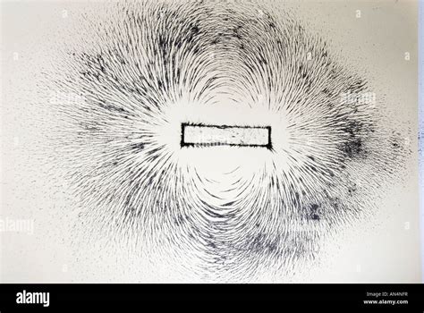 Magnetic field lines around a bar magnet shown with iron filings Stock ...