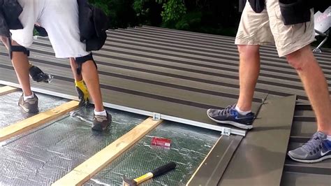 Standing seam roof installation - YouTube