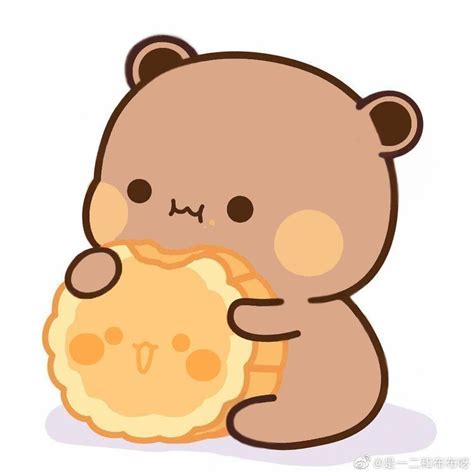 a brown teddy bear holding a pie in its paws