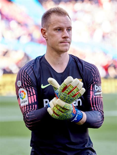 BARCELONA, SPAIN - MARCH 30: Ter Stegen of FC Barcelona puts on his ...