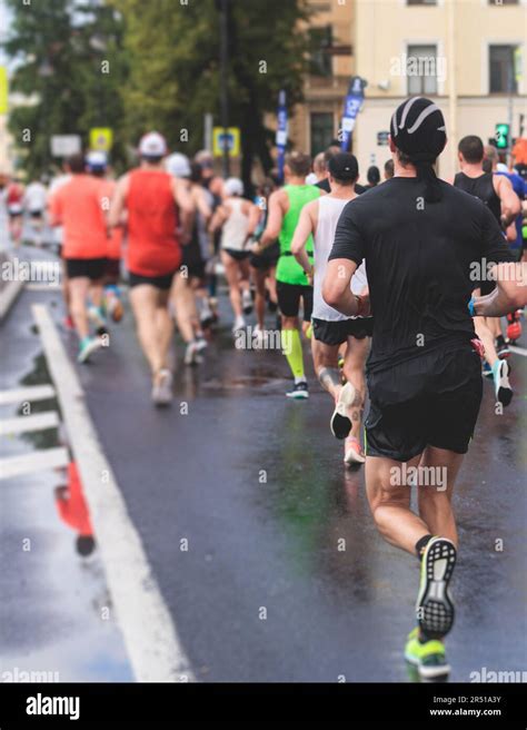 Marathon runners crowd, participants start running the half-marathon in ...