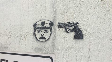 Disturbing graffiti with gun and officer emojis pops up around Houston ...