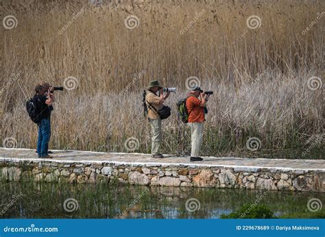 Photographers on Prespa Lake Photographing Birds with Telephoto Lenses ...