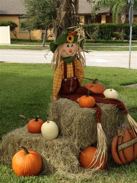 Scarecrow, pumpkin and hay bales. Cute fall display and photo op for ...