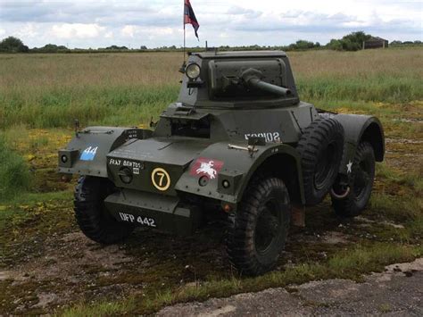 an army vehicle parked in the middle of a field