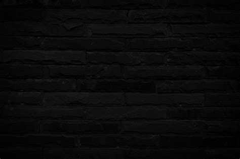 Old black brick wall texture for background with copy space for design ...