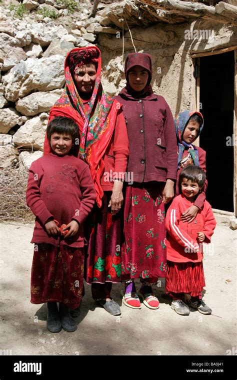 Tajik family wearing traditional dress and hat, Marguzor village Stock ...