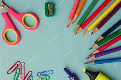 Premium Photo | Top view of school supplies and office supplies on blue ...