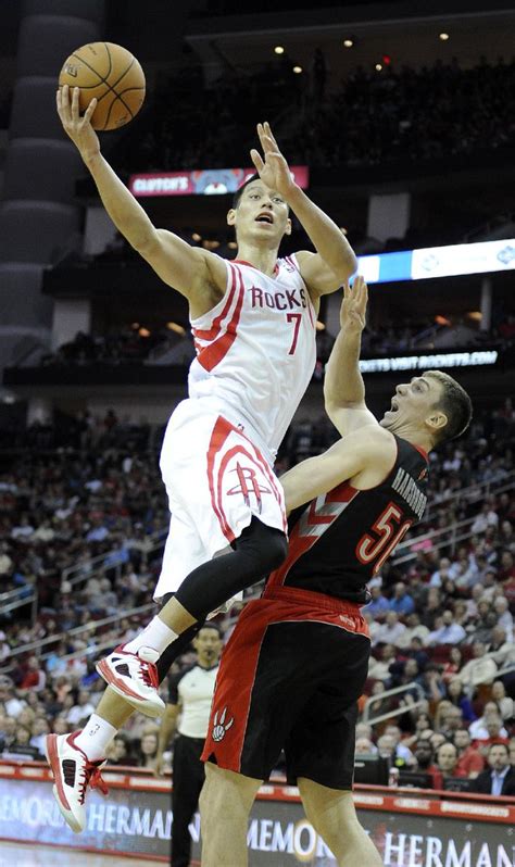 Houston Rockets' Jeremy Lin (7) shoots over Toronto Raptors' Tyler ...