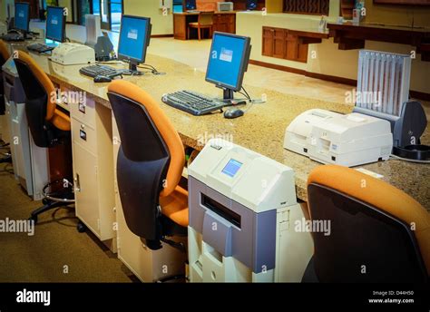 Bank interior teller stations w/ computer monitors Stock Photo - Alamy