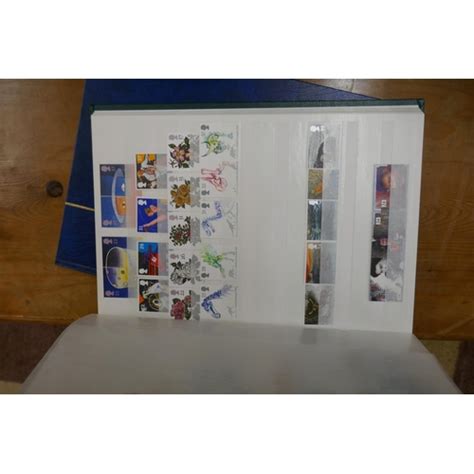 Stamps - 3 stamp albums together with stamp catalogue