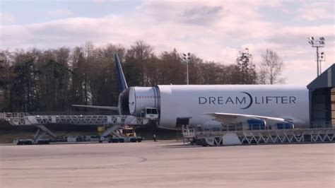 Boeing 787 Fuselage being offloaded from dreamlifter plus F-18 Takeoff ...