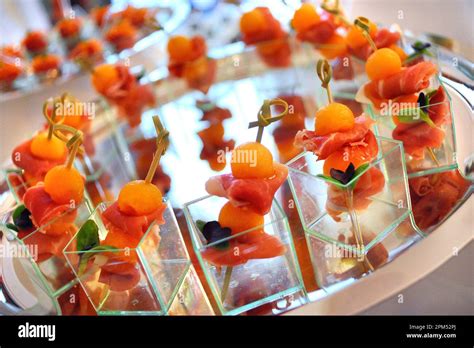 Italian food recipes, skewers of Parma ham and melon Stock Photo - Alamy