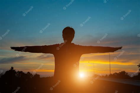 Premium Photo | Silhouette of woman pointing with finger in sky