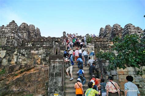 Tourists on the stairs of Phnom Bakheng, Angkor, Cambodia