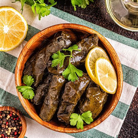 Premium Photo | Dolma, stuffed grape leaves with rice and meat on dark ...