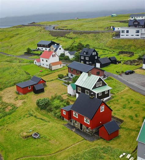 an aerial view of several houses in the countryside with green grass ...