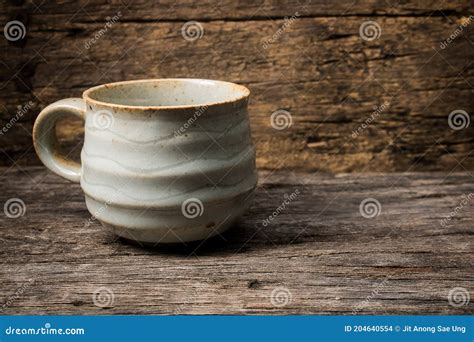 Handmade Ceramic Coffee Cup on Wooden Table Stock Photo - Image of mugs ...