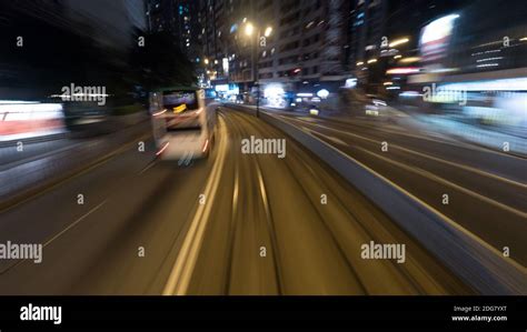 Traveling by tram in night Hong Kong Stock Photo - Alamy