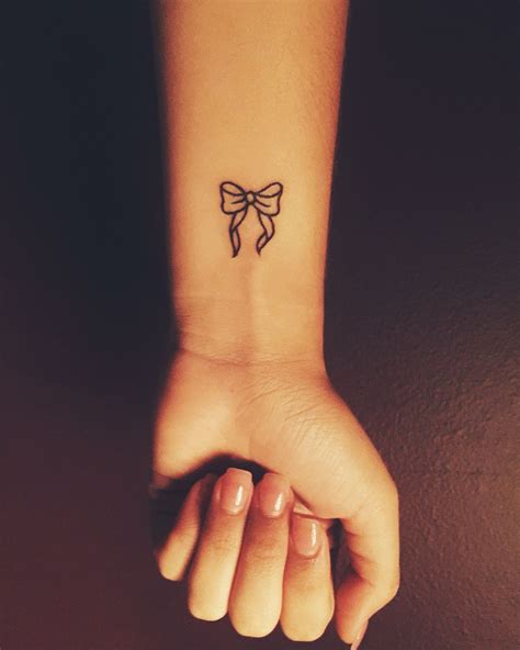 Small bow tattoo- cute wrist tattoo- | Neck tattoo, Small bow tattoo ...