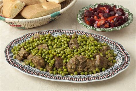 Traditional Moroccan Dish with Meat, Peas, Beet Salad and Bread Stock ...