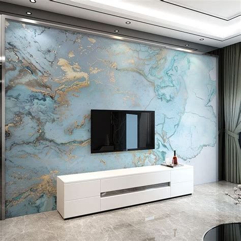 a modern living room with marbled walls and white furniture, including ...